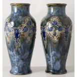 Pair of Doulton Lambeth stoneware vases, baluster form, applied decoration, 24.5cm tall.