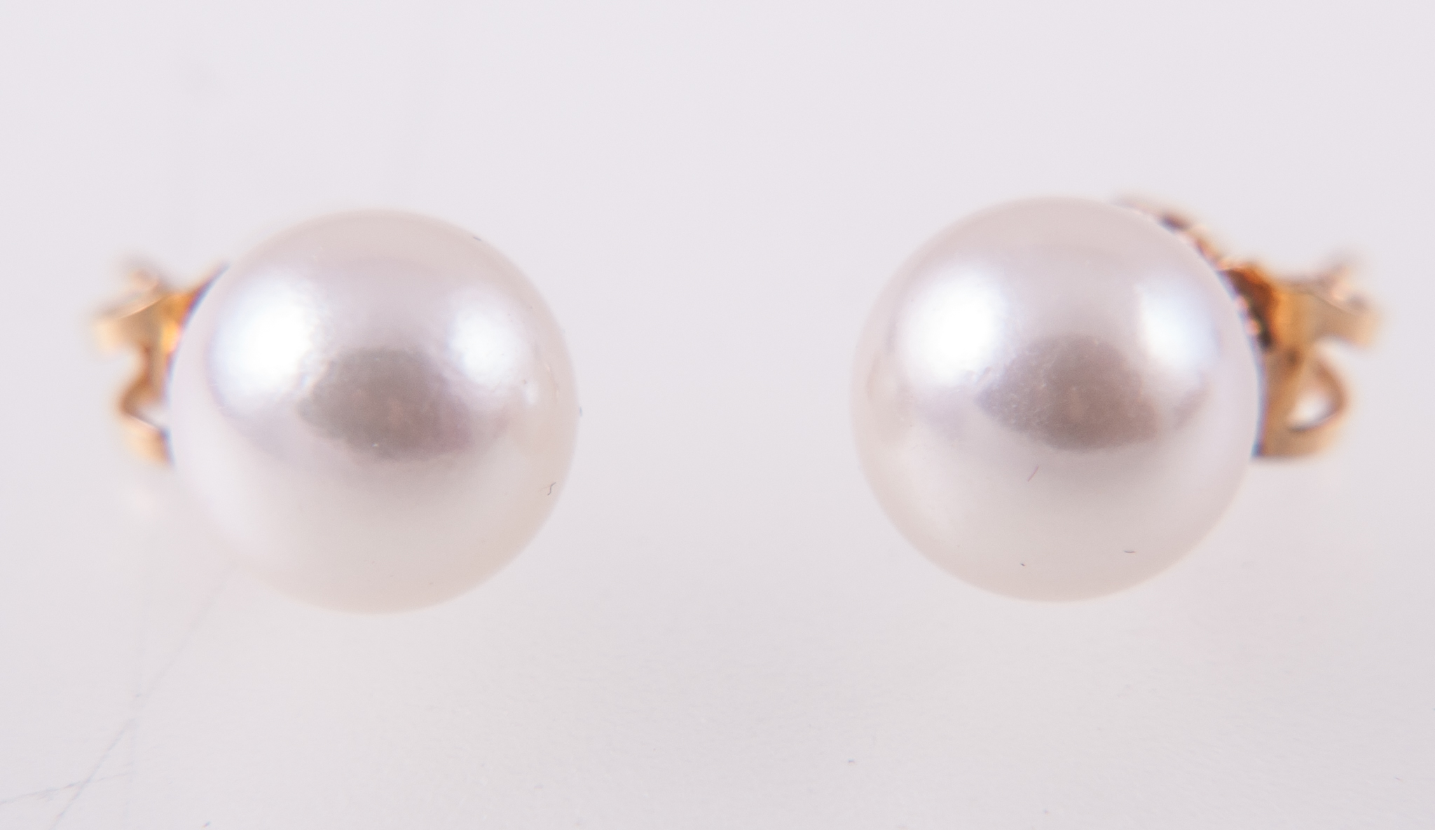 A pair of cultured pearl stud earrings, 9mm pearls, pierced fittings with post and butterfly.