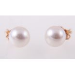 A pair of cultured pearl stud earrings, 9mm pearls, pierced fittings with post and butterfly.