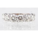 A diamond seven stone half eternity ring, the brilliant cut stones, slightly graduating in size,