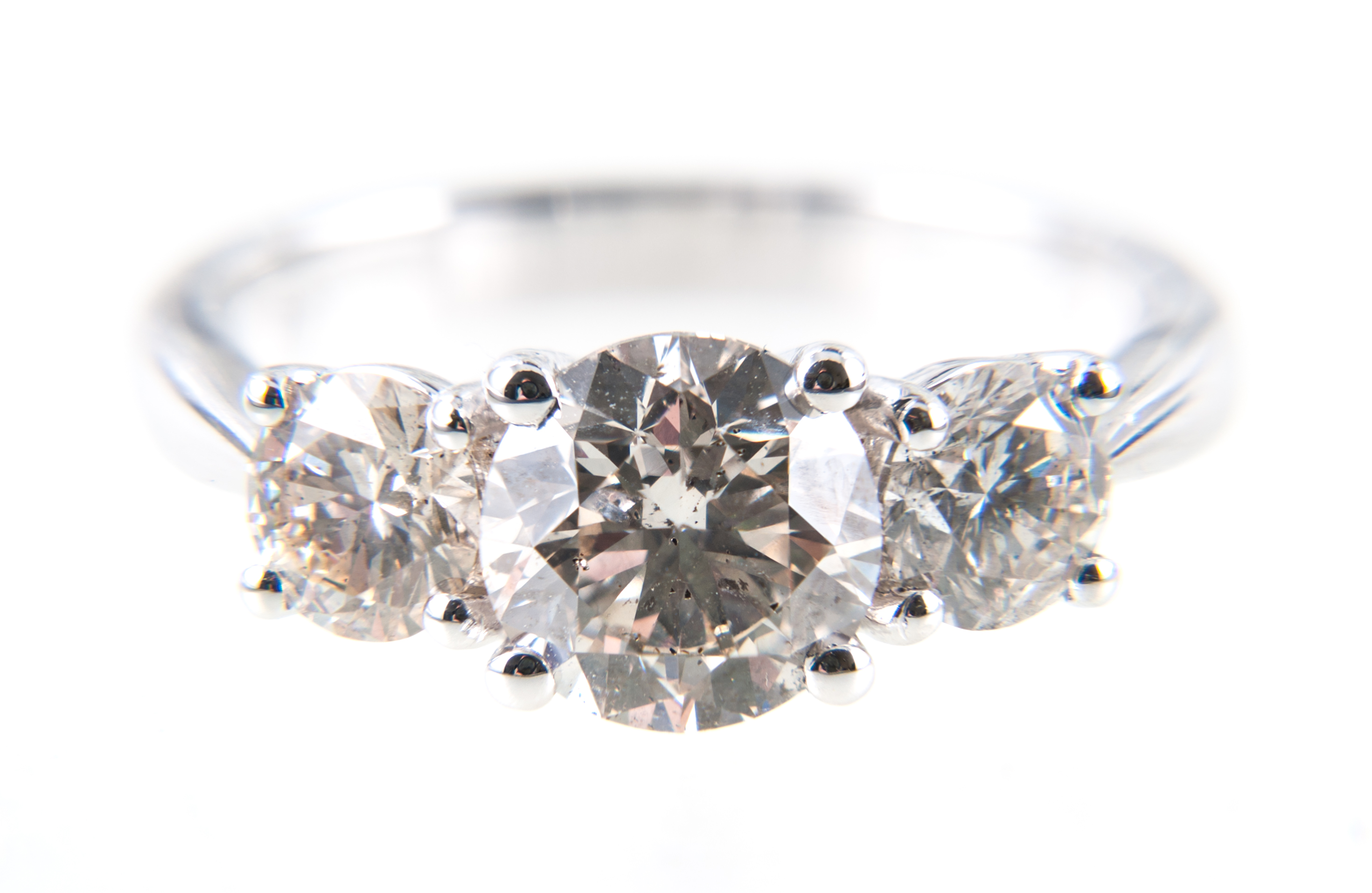 A diamond three stone ring, the brilliant cut stones, graduating in size,