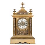 French and gilt metal and silvered mantle clock with urn finials,