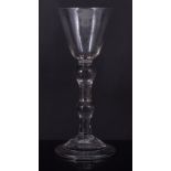 Double-knopped wine glass, mid 18th century, rounded funnel bowl with a shoulder knop,