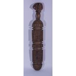 A tribal club, carved patterns, 65cms.