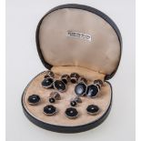 A cased set of silver dress studs, comprising a pair of cufflinks,