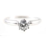 A diamond solitaire ring,