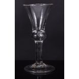 Bell bowl wine glass, mid 18th century with tear drop over the plain stem, folded foot, 14cm.