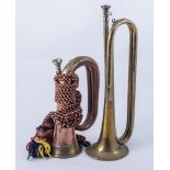 An American copper and brass bugle, dated 1916 and stamped Michigan USA, with rope tassel, 26cms,