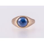A blue cabochon cut stone dress ring, the round cabochon cut stone 8.