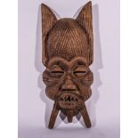 Large grotesque carved wood mask, 79cm.