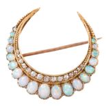 An opal and diamond closed crescent brooch,