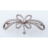 A diamond open work bow brooch,