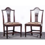 A set of six Hepplewhite style mahogany dining chairs, panelled backs, pierced vase splats,