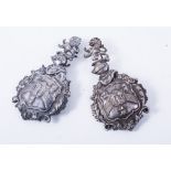 Pair of 19th Century cast nickel armorial harness mounts, 9cm, (2).