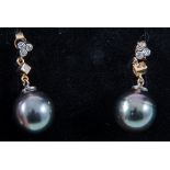 A pair of Tahitian black pearl earrings, the 13.