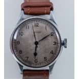 Longines - A gentleman's military watch, circular buff coloured dial with Arabic numerals,