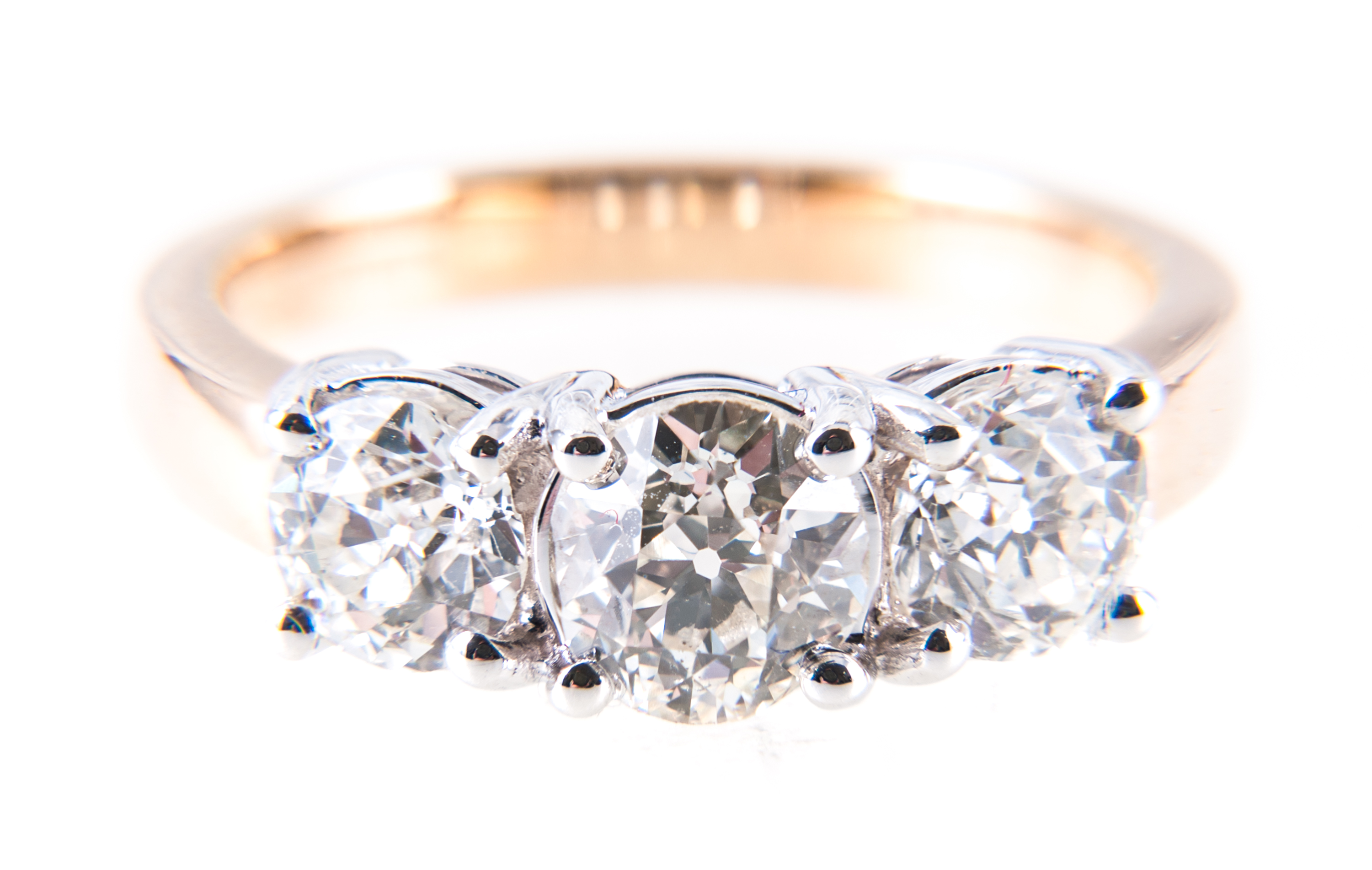 A diamond three stone ring, the brilliant cut stones, slightly graduating in size,