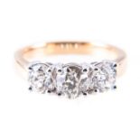 A diamond three stone ring, the brilliant cut stones, slightly graduating in size,