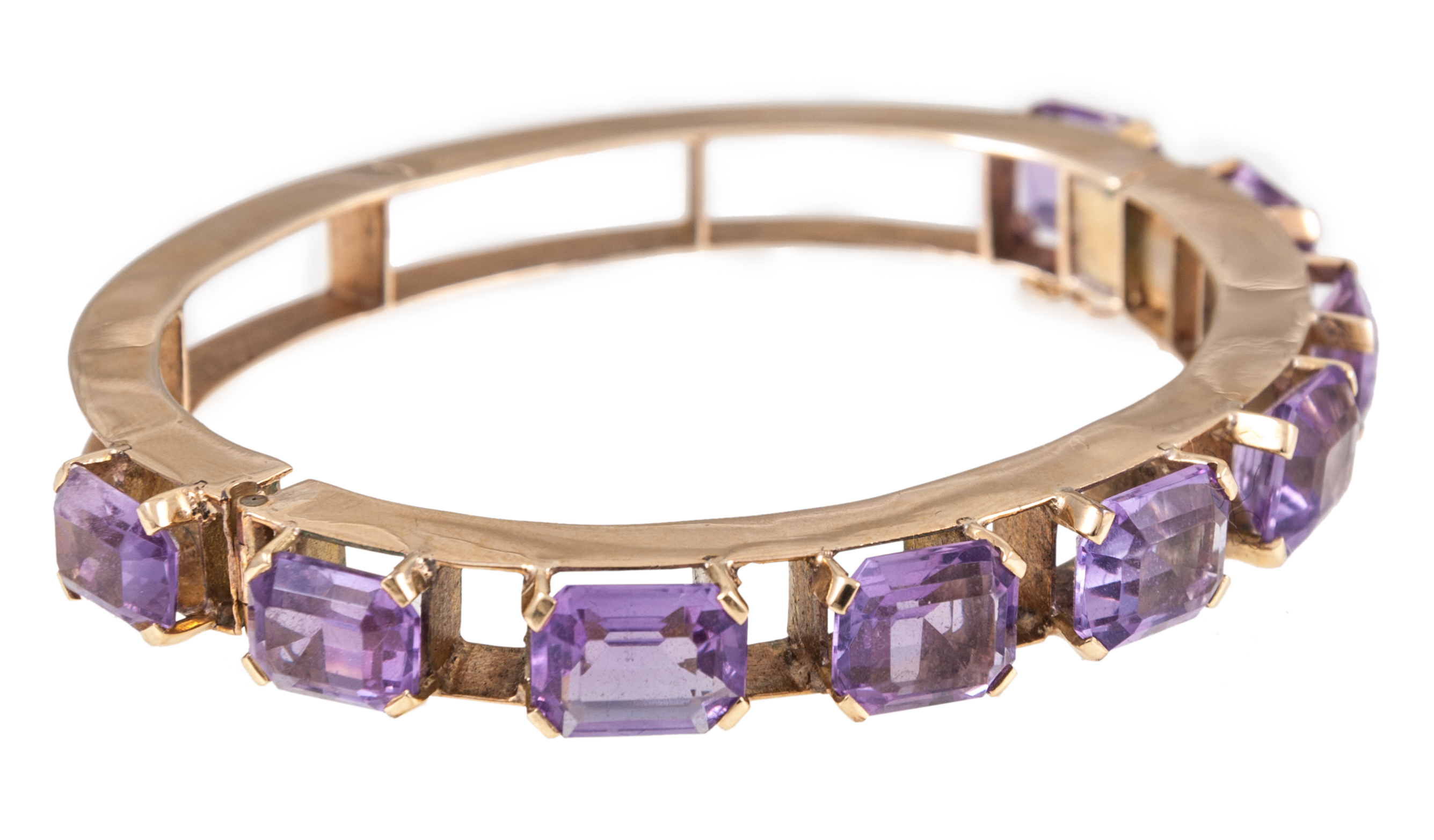 A 9 carat yellow gold and amethyst bangle,