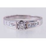 A diamond solitaire ring,