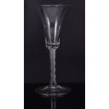 Bell bowl wine glass, mid 18th century, multiple spiral, air twist stem, folded foot, 17.5cms.