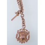 A hallmarked 9 carat rose gold double albert,