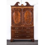 George III mahogany linen press, swan neck pediment and panelled doors enclosing shelves,