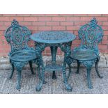 Cast iron patio set, comprising circular table, splayed legs, Britannia, paw feet, diameter 57cm,