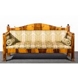 Biedermeier style lignum vitae sofa, upholstered in cotton brocade, arched back, vertical ends,