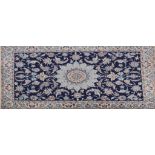 Isfahan pattern rug, central medallion on a blue ground scrolling foliate field,