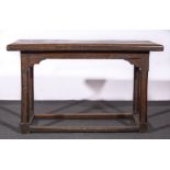 A joined oak table, in part probably 17th century, later four plank top, turned legs, plain rails,