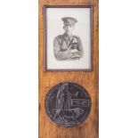 A WWI bronze death plaque, named Albert Henry Pollard, diameter 12cms,