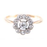 A circular diamond cluster ring,