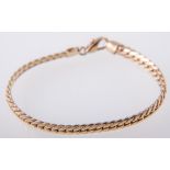 A yellow metal bracelet, 5mm wide flat square curb link chain, 19cm long, stamped 750,