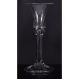 Bell bowl wine glass, mid 18th century, with tear into plain stem, folded foot, 16.5cm.