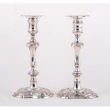 George II/III matched pair of silver candlesticks, one probably by James Gould, London 1745,