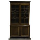 George III style inlaid mahogany bookcase, moulded cornice with a cross-banded frieze and stringing,