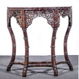 Chinese rosewood console table, bowfront form, simulated bamboo carved outlines,