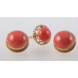 A coral dress ring and pair of coral earrings, a 12.