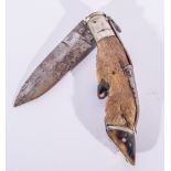 A hunting knife, deers foot grip, folding blade, 34cms overall.