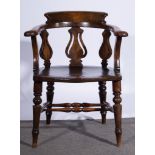 A 19th Century beech and elm club chair, 65cm wide, 82cm high.