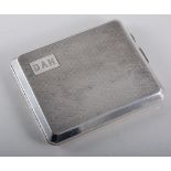 Silver cigarette case with wavy line engine turned decoration, initial plate engraved "DAH",