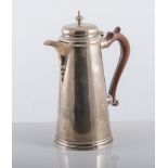 A silver Queen Anne style coffee pot, wooden handle, hallmarked Birmingham 1972,
