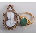 Two carved shell cameo brooches in yellow metal mounts,