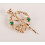 9 carat yellow scarf pin set with two green stones,