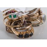 A collection of ten dress rings, platinum, 9 carat and 18 carat gold set with garnets, pearls,