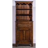 Narrow reproduction oak dresser, carved fascia, cutlery drawer, single drawer and single cupboard,