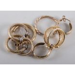 Eight pairs of gold creole hoop earrings,