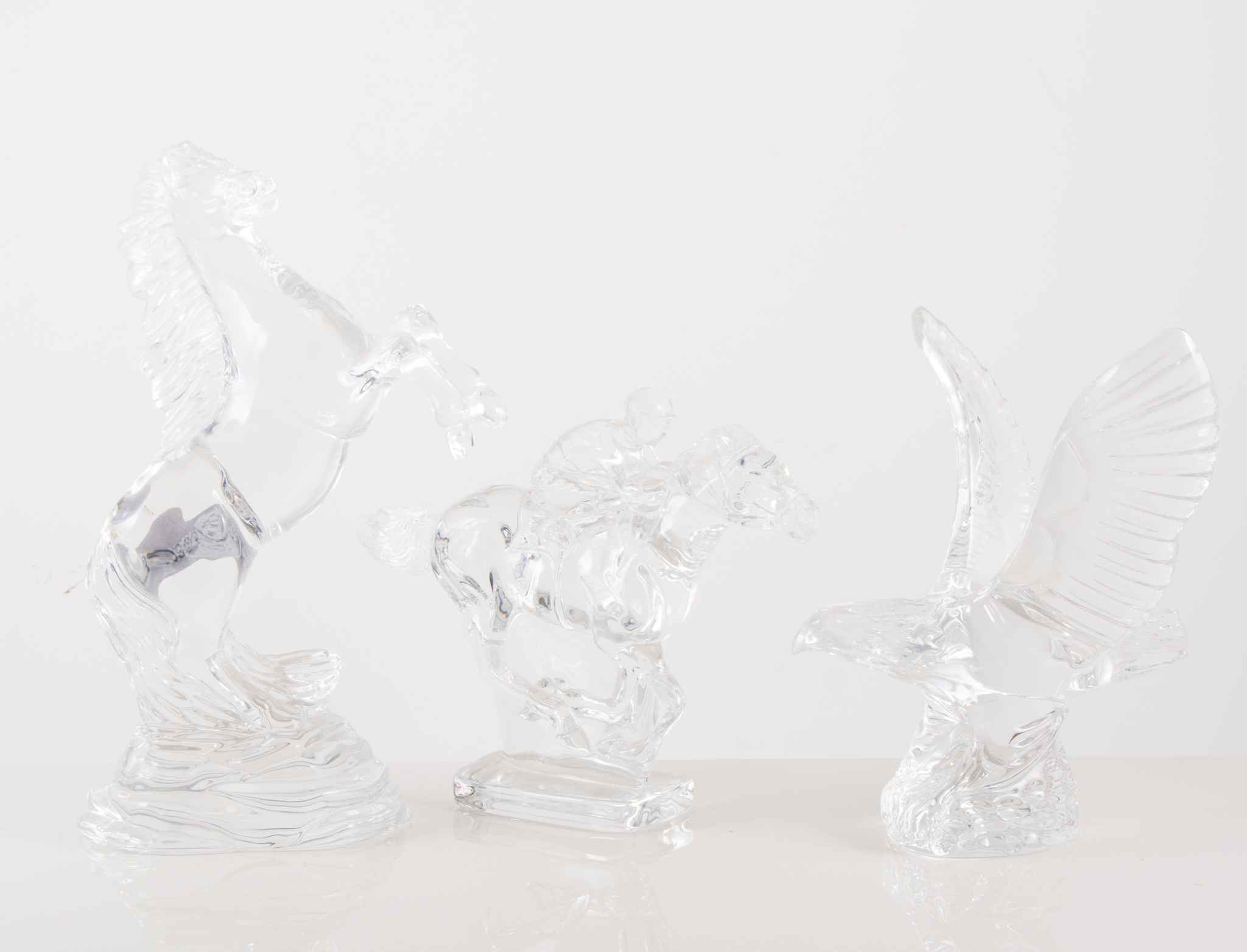 Waterford crystal: A pair of seahorse candlesticks, 29cm, similar pedestal bowl, 31cm, Jockey,