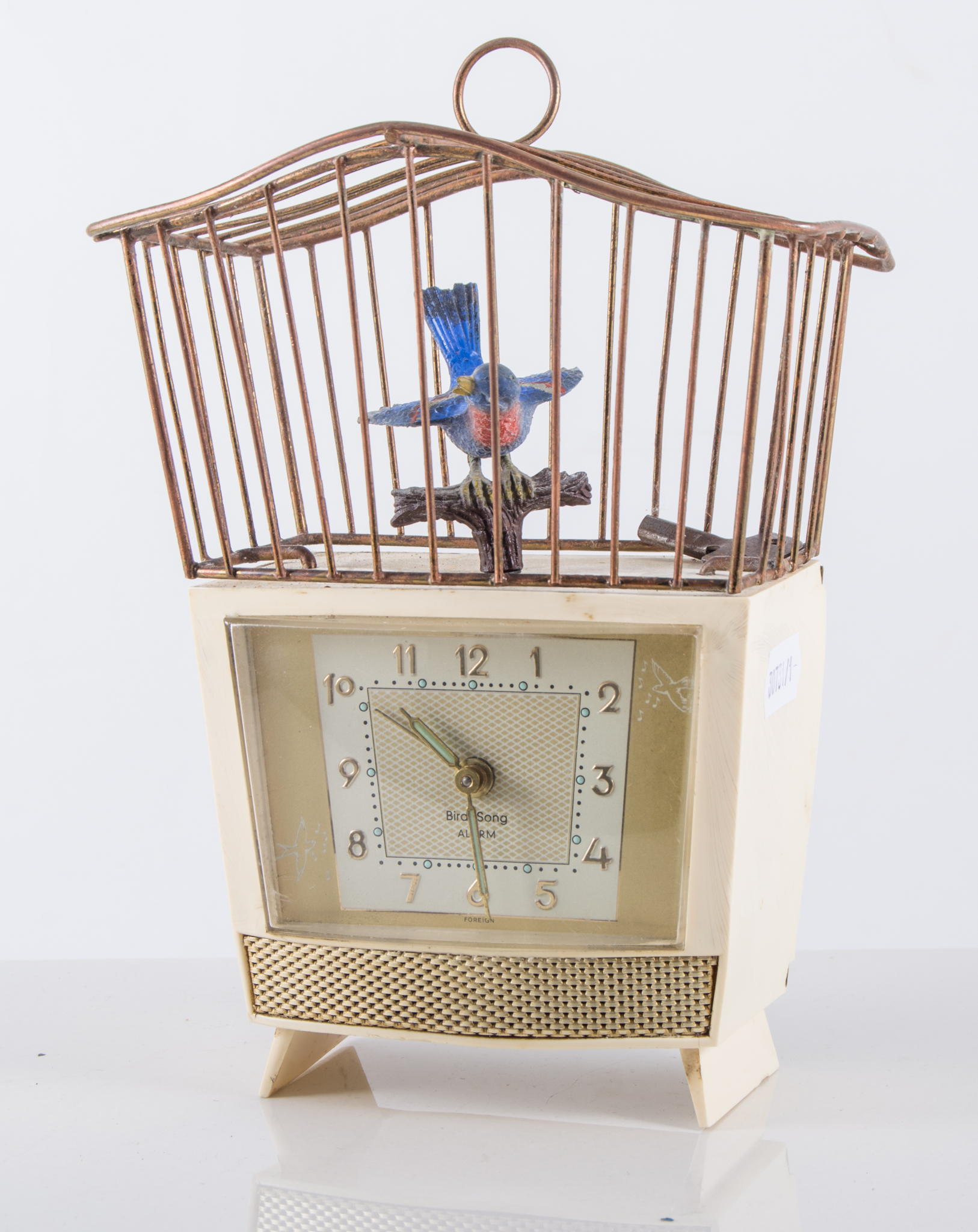 Bird Song Automaton Alarm Clock, cream plastic clock with Arabic numerals and luminous hands,